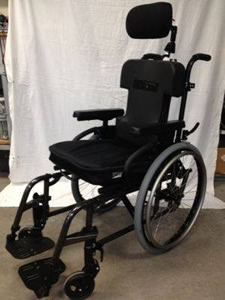 Manual wheelchair with head support.